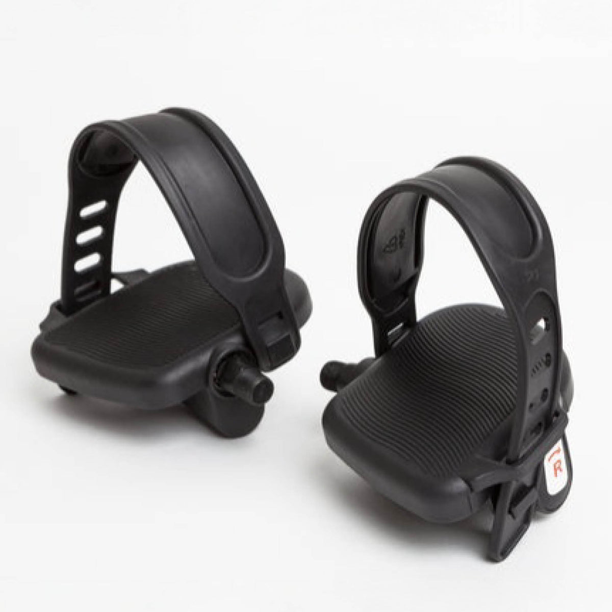 A pair of black pedal straps with wide foot platforms and adjustable plastic straps, designed for the Reviber Mini Bike PRO - Dual Function by Reviber, are shown against a plain white background.